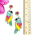 tropical bird earrings in vibrant colors next to ruler showing size is roughly 3.5 inches in length
